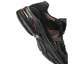 New Balance 2010 Black side view — outdoor profile
