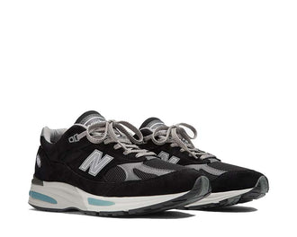 New Balance 991 Made in UK Black Smoked Pearl vue latérale — cuir et mesh premium