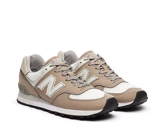 New Balance 576 UK Flint Gray vista lateral — cuero y malla premium